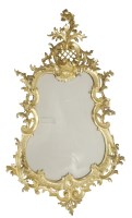 Lot 525 - An ornate gilt framed wall mirror