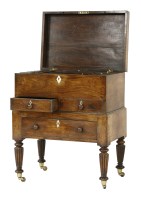 Lot 526 - A George IV mahogany workbox on stand