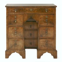 Lot 543 - A George II walnut kneehole desk