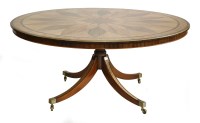 Lot 576 - A circular dining table