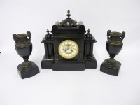 Lot 237 - A Victorian black marble clock garniture