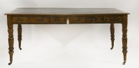 Lot 1466 - A walnut veneered library table