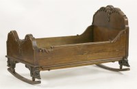 Lot 1402 - A 19th century carved walnut child's cradle