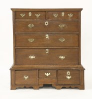Lot 1460 - An 18th century oak chest on a low stand