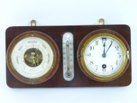 Lot 1316 - A wall mounted clock and barometer