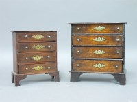 Lot 1254 - An early 19th century oak miniature chest of four drawers