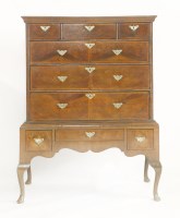 Lot 1584 - An 18th century walnut chest on stand