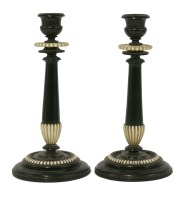 Lot 156 - A pair of Anglo-Indian ebony and ivory candlesticks