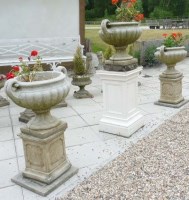 Lot 787 - A pair of reconstituted stone garden urns