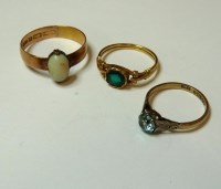 Lot 14 - An 18ct gold green paste ring