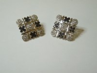 Lot 9 - A pair of 9ct gold noughts and crosses stud earrings