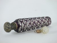 Lot 79 - A cut glass and stained purple perfume bottle