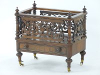 Lot 611 - A Victorian walnut canterbury