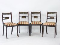 Lot 635A - A set of four Regency stained beech and brass inlaid bar back dining chairs