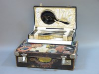 Lot 147 - A cased set of tortoiseshell and silver backed dressing items