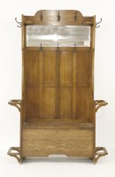 Lot 576 - An Arts & Crafts oak settle