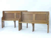 Lot 728 - A small pair of panelled oak pews