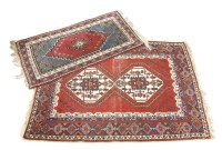 Lot 562 - A Caucasian red ground rug