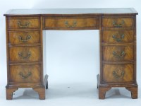 Lot 718 - A modern serpentine fronted writing desk