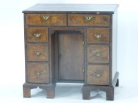 Lot 781 - A reproduction Queen Anne style kneehole desk