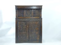 Lot 571 - A 17th century and later oak court cupboard