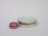Lot 105 - A silver and guilloche enamel circular box