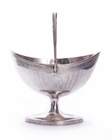 Lot 202 - A George III Scottish silver swing-handled sugar basket
