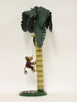 Lot 427 - An early 20th century mechanical tin monkey on a coconut tree