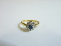 Lot 47 - An 18ct gold sapphire and diamond cluster ring
