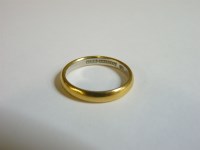 Lot 54 - A plain gold wedding ring