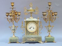 Lot 395 - An onyx clock set with gilt metal fittings