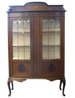 Lot 573 - An Edwardian mahogany bowfront display cabinet