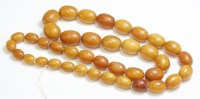 Lot 333 - A single row graduated amber bead necklace