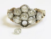 Lot 309 - A Victorian nine stone diamond daisy cluster ring with diamond set shoulders