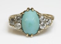 Lot 313 - A late Victorian turquoise and diamond carved head ring