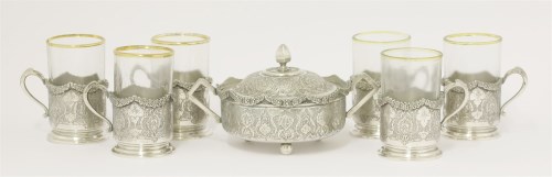 Lot 17 - A set of six Persian metalwares cup holders