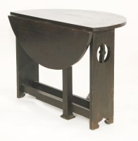 Lot 1417 - An Arts and Crafts oak drop-leaf table
