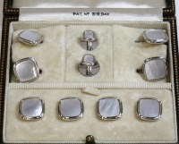 Lot 68 - A cased Art Deco white gold mother-of-pearl dress stud set