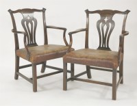 Lot 620 - A pair of George III mahogany elbow chairs