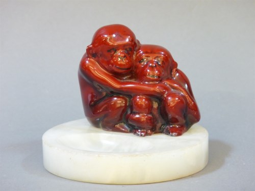 Lot 197 - A Royal Doulton flambé and alabaster ashtray