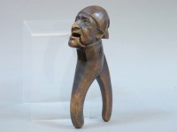 Lot 205 - A treen nutcracker in the form of a gentleman's face