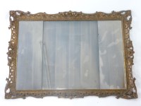 Lot 645 - A carved giltwood wall mirror