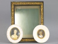 Lot 180 - A pair of early 20th century portrait miniatures in piano ivory mounts