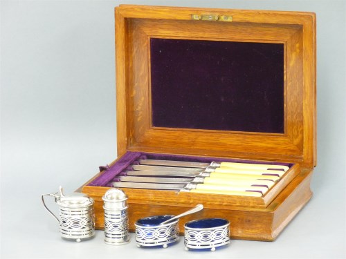 Lot 115 - A set of six silver fish knives and forks in an oak case
