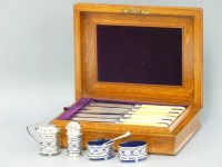 Lot 115 - A set of six silver fish knives and forks in an oak case