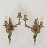 Lot 451 - A pair of gilt bronze twin branch wall lights