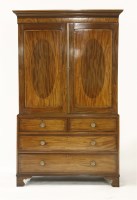 Lot 1517 - A George III inlaid mahogany linen press