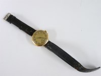 Lot 57 - A gentleman's 9ct gold mechanical strap watch