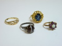 Lot 3 - A 9ct gold opal and garnet cluster ring