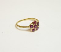 Lot 18 - A six stone spinel daisy cluster ring